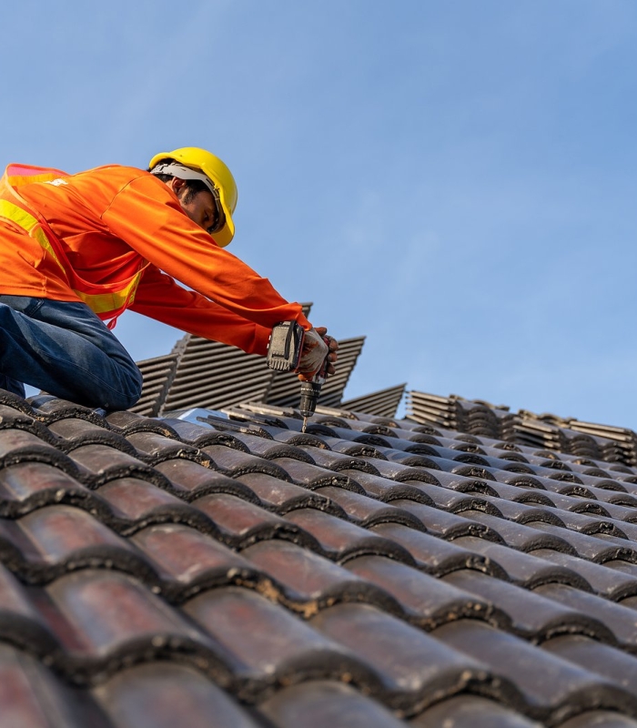 bigstock-A-Roofer-Working-On-Roof-Struc-455939139