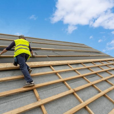 roofer-working-on-roof-scaled